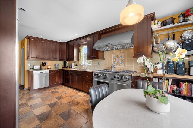 27 Neulist Ave, Port Washington, NY 11050 - kitchen featuring appliances with stainless steel finishes, wall chimney exhaust hood, decorative backsplash, stone finish floors, and light stone counters