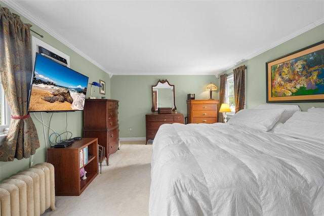 27 Neulist Ave, Port Washington, NY 11050 - bedroom featuring radiator heating unit, light carpet, and ornamental molding