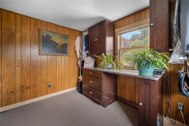 27 Neulist Ave, Port Washington, NY 11050 - carpeted office space with wood walls and baseboards