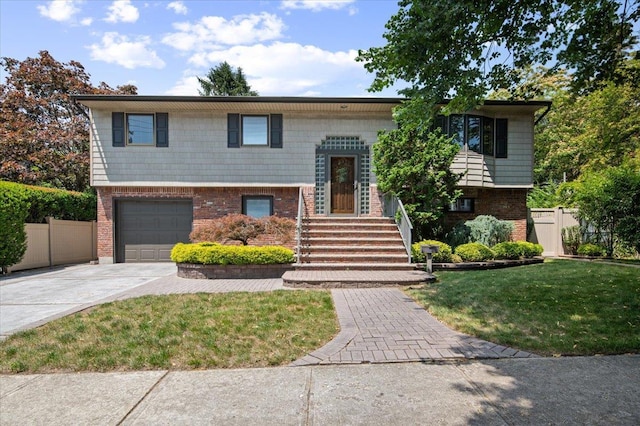 713 Thomas Ave, Baldwin, NY 11510 - bi-level home featuring brick siding, driveway, and a garage