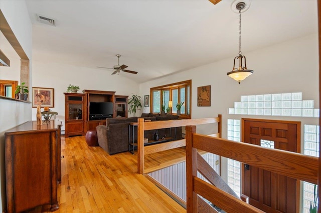 713 Thomas Ave, Baldwin, NY 11510 - hallway with light wood-type flooring, lofted ceiling, and an upstairs landing