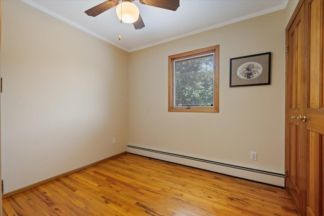 713 Thomas Ave, Baldwin, NY 11510 - empty room featuring baseboard heating, light wood-style floors, ornamental molding, and ceiling fan