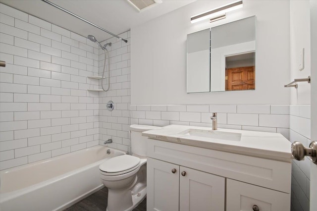 713 Thomas Ave, Baldwin, NY 11510 - full bathroom with tile walls, vanity, and tub / shower combination