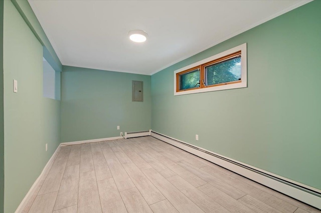 713 Thomas Ave, Baldwin, NY 11510 - spare room with baseboard heating, electric panel, wood finished floors, and ornamental molding