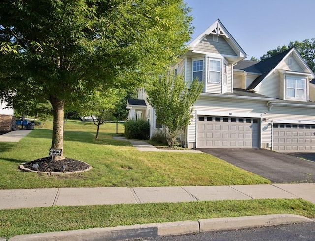 49 Cornwall Ln, Middletown, NY 10940 - view of front of house featuring a garage, asphalt driveway, and a front lawn