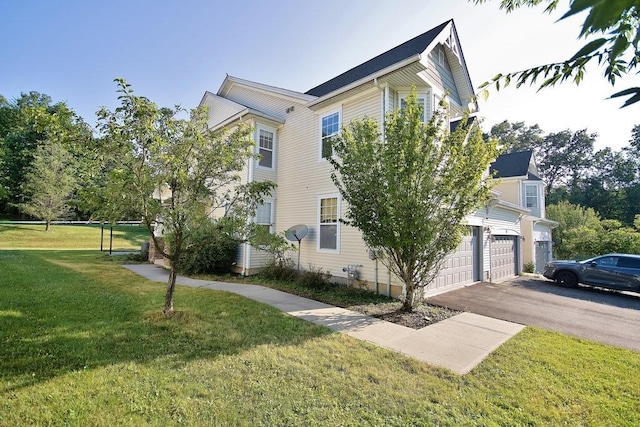 49 Cornwall Ln, Middletown, NY 10940 - view of property exterior with an attached garage, driveway, and a yard