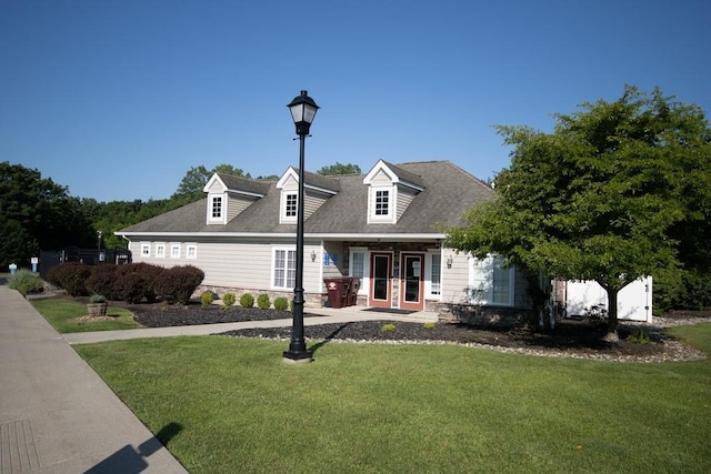 49 Cornwall Ln, Middletown, NY 10940 - cape cod home featuring a front lawn, stone siding, and roof with shingles