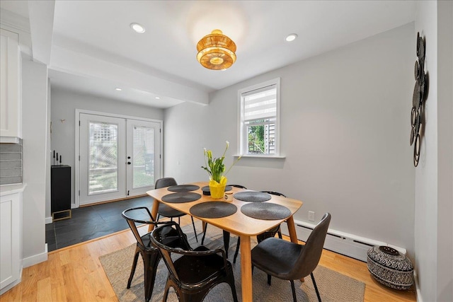 56 Summers St, Oyster Bay, NY 11771 - dining space with baseboard heating, french doors, light wood finished floors, and recessed lighting
