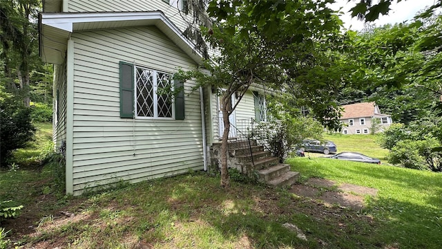 16 Upper Ferndale Rd, Liberty, NY 12754 - view of side of home featuring a lawn and entry steps
