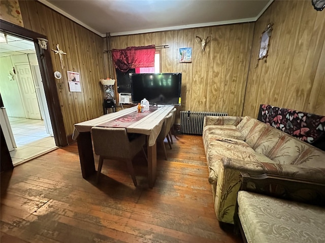 16 Upper Ferndale Rd, Liberty, NY 12754 - rec room featuring radiator heating unit, hardwood / wood-style flooring, wood walls, and ornamental molding