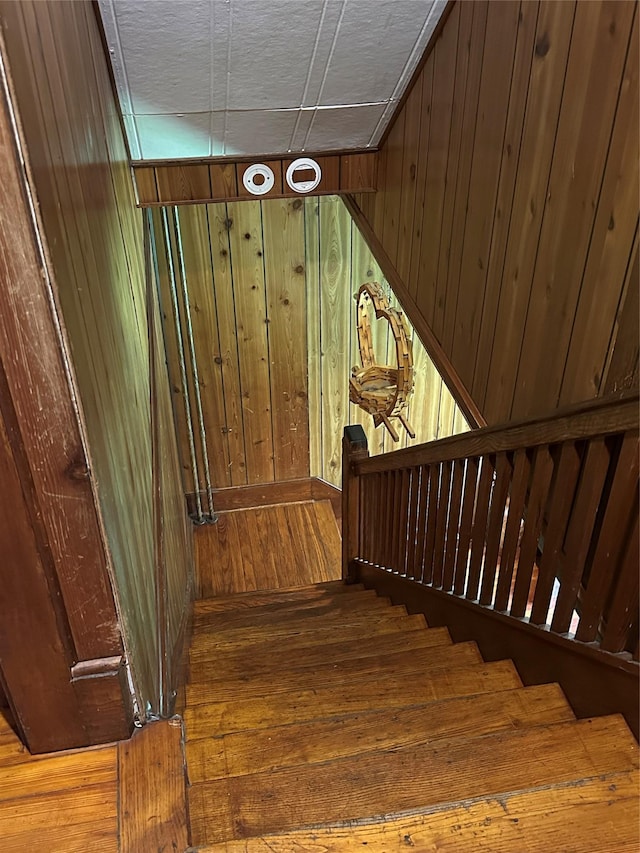 16 Upper Ferndale Rd, Liberty, NY 12754 - staircase with wooden walls and hardwood / wood-style flooring