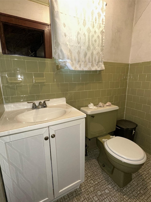 16 Upper Ferndale Rd, Liberty, NY 12754 - bathroom with vanity, tile walls, and wainscoting