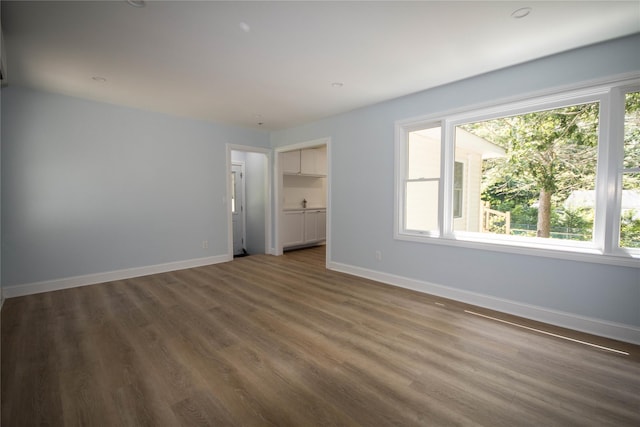 64 Maple Ave, Flanders, NY 11901 - unfurnished room with healthy amount of natural light and wood finished floors