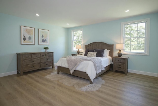 64 Maple Ave, Flanders, NY 11901 - bedroom featuring multiple windows, light wood finished floors, and recessed lighting