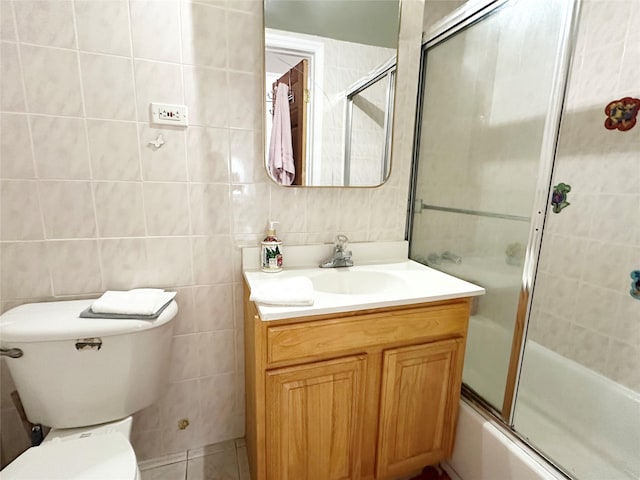 14 Upper Ferndale Rd, Liberty, NY 12754 - bathroom with vanity, combined bath / shower with glass door, tile patterned flooring, and tile walls