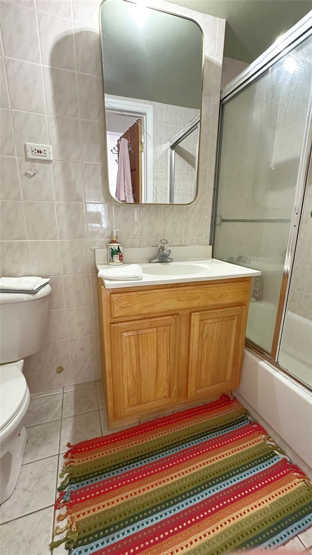 14 Upper Ferndale Rd, Liberty, NY 12754 - bathroom featuring vanity, enclosed tub / shower combo, tile patterned floors, and tile walls
