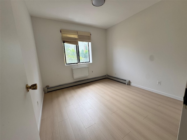 43-53 159th St, Flushing, NY 11358 - unfurnished room with wood finished floors and baseboard heating
