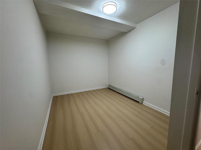 43-53 159th St, Flushing, NY 11358 - spare room with a baseboard radiator and wood finished floors