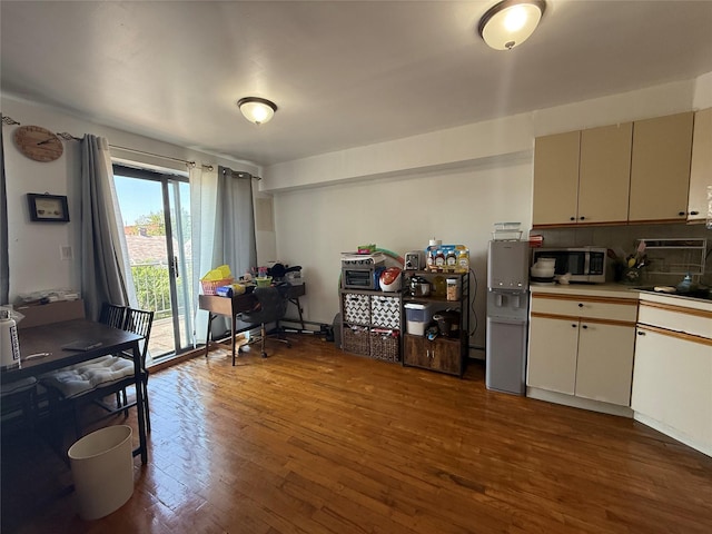 43-53 159th St, Flushing, NY 11358 - kitchen featuring stainless steel microwave, wood finished floors, and light countertops