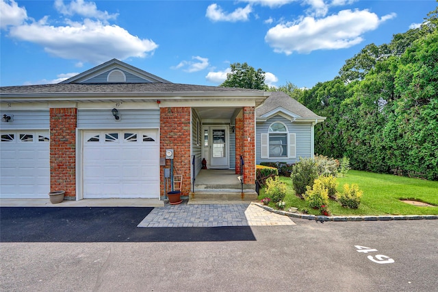 49 Primrose Ln, North Babylon, NY 11703 - view of front of house featuring brick siding, roof with shingles, and a front lawn