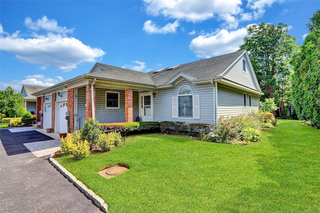 49 Primrose Ln, North Babylon, NY 11703 - view of front of property with asphalt driveway, a porch, a front yard, a shingled roof, and an attached garage