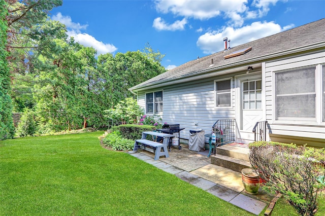 49 Primrose Ln, North Babylon, NY 11703 - view of grassy yard with a patio area