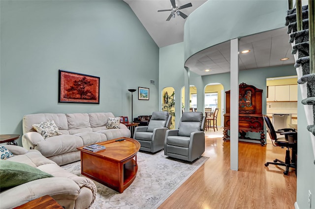49 Primrose Ln, North Babylon, NY 11703 - living area featuring arched walkways, high vaulted ceiling, wood finished floors, ceiling fan, and recessed lighting