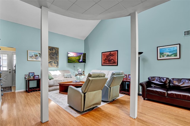 49 Primrose Ln, North Babylon, NY 11703 - living room with high vaulted ceiling and light wood finished floors