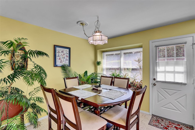 49 Primrose Ln, North Babylon, NY 11703 - dining space featuring plenty of natural light and a chandelier