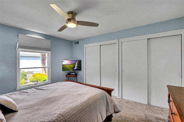 49 Primrose Ln, North Babylon, NY 11703 - carpeted bedroom featuring two closets and ceiling fan