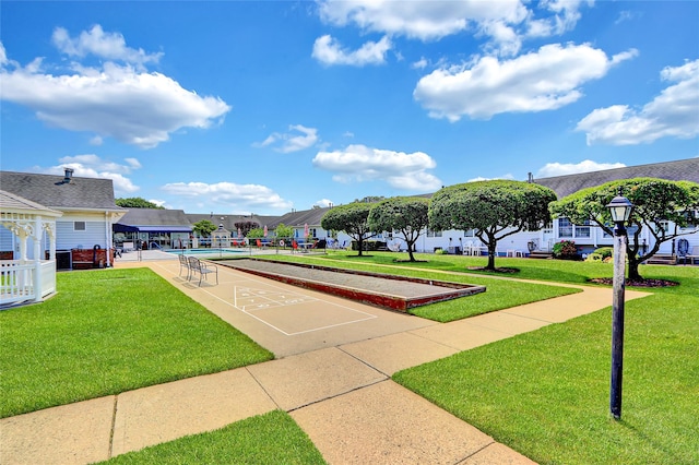 49 Primrose Ln, North Babylon, NY 11703 - view of community with shuffleboard and a lawn