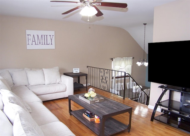 13 Lark Dr, Centereach, NY 11720 - living area featuring a chandelier, ceiling fan, wood finished floors, and vaulted ceiling