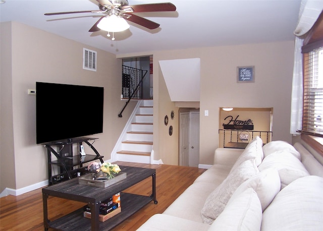 13 Lark Dr, Centereach, NY 11720 - living room featuring stairway, a ceiling fan, and wood finished floors