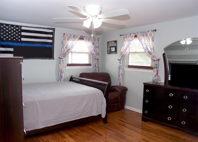 13 Lark Dr, Centereach, NY 11720 - bedroom featuring multiple windows, wood finished floors, and a ceiling fan