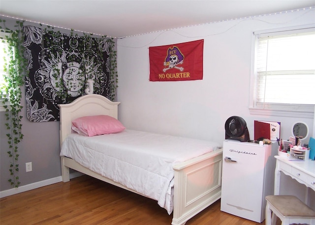 13 Lark Dr, Centereach, NY 11720 - bedroom with light wood-type flooring and baseboards