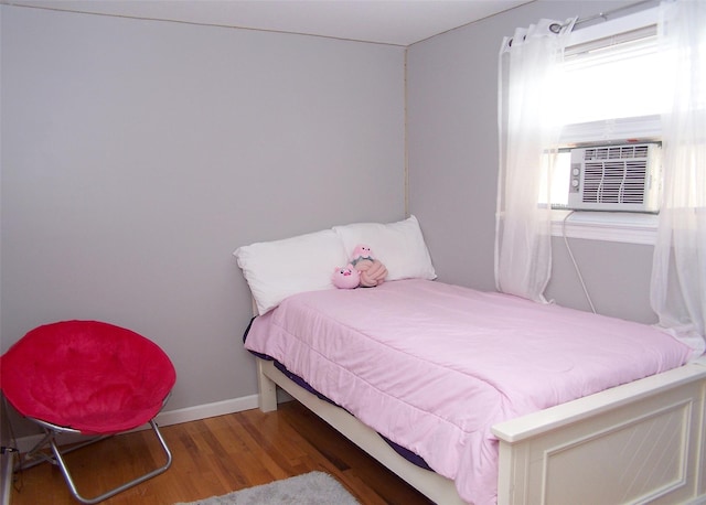 13 Lark Dr, Centereach, NY 11720 - bedroom with wood finished floors and cooling unit