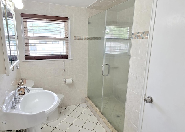 13 Lark Dr, Centereach, NY 11720 - bathroom featuring a shower stall, tile walls, and tile patterned floors