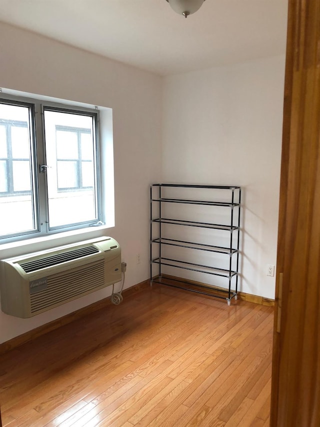 147-30 Barclay Ave Unit 3B, Flushing, NY 11355 - bedroom featuring light wood-type flooring and an AC wall unit