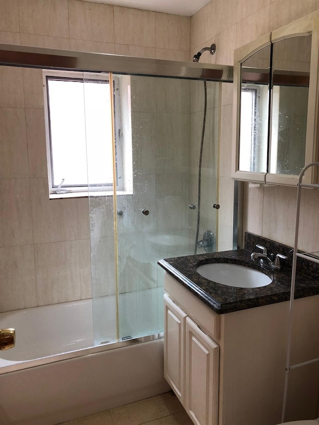 147-30 Barclay Ave Unit 3B, Flushing, NY 11355 - full bath with vanity, shower / bath combination with glass door, healthy amount of natural light, and tile patterned flooring