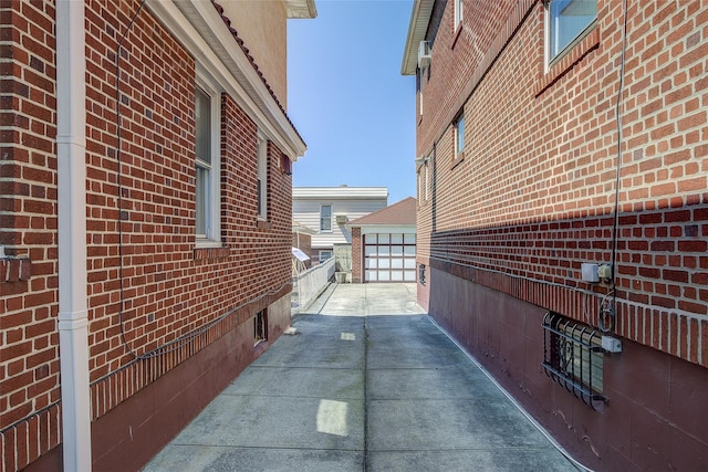 8507 Union Tpke, Glendale, NY 11385 - view of home's exterior with brick siding and a detached garage