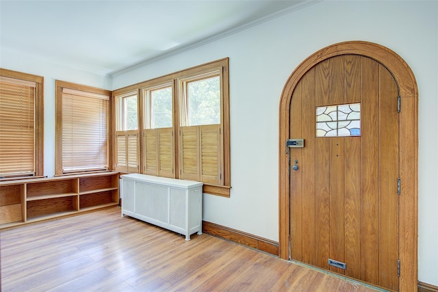 8507 Union Tpke, Glendale, NY 11385 - entrance foyer featuring wood finished floors, radiator, and ornamental molding