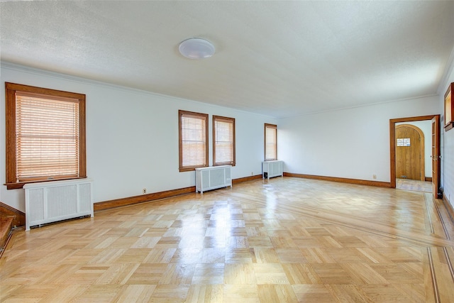 8507 Union Tpke, Glendale, NY 11385 - spare room with radiator, healthy amount of natural light, and ornamental molding