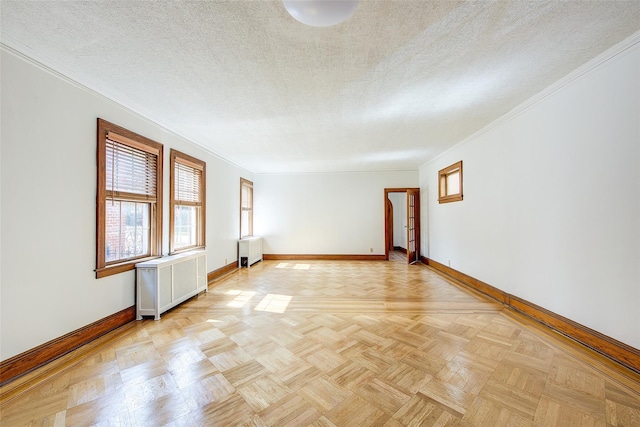 8507 Union Tpke, Glendale, NY 11385 - empty room with radiator, crown molding, and a textured ceiling