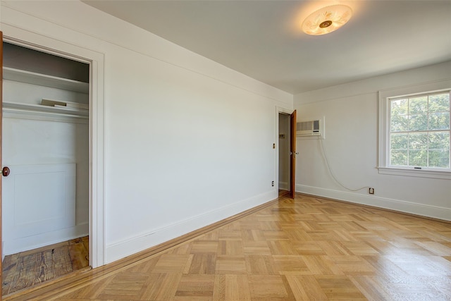 8507 Union Tpke, Glendale, NY 11385 - unfurnished bedroom with baseboards and a wall mounted air conditioner
