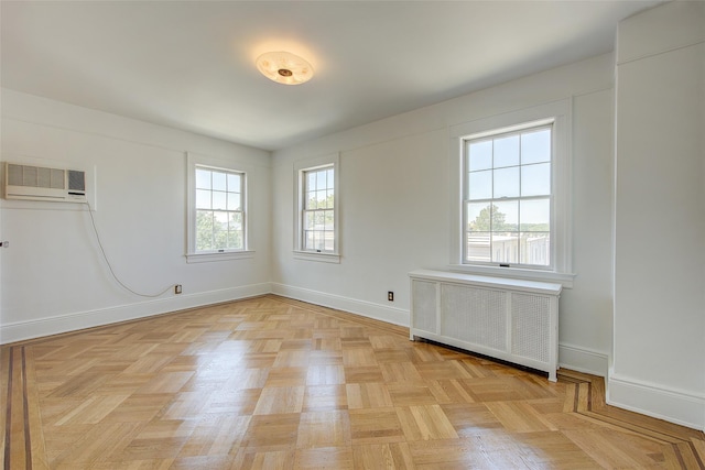 8507 Union Tpke, Glendale, NY 11385 - unfurnished room featuring radiator and an AC wall unit
