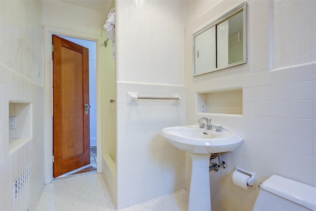 8507 Union Tpke, Glendale, NY 11385 - full bathroom featuring tile walls, tile patterned floors, a bathtub, and a shower