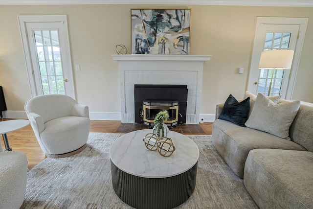 48 Faneuil Pl, New Rochelle, NY 10801 - living area with healthy amount of natural light, a brick fireplace, and wood finished floors