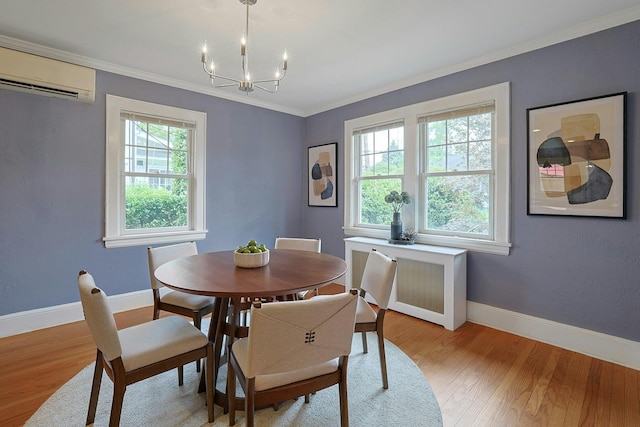 48 Faneuil Pl, New Rochelle, NY 10801 - dining room with a chandelier, an AC wall unit, light wood-style floors, and crown molding