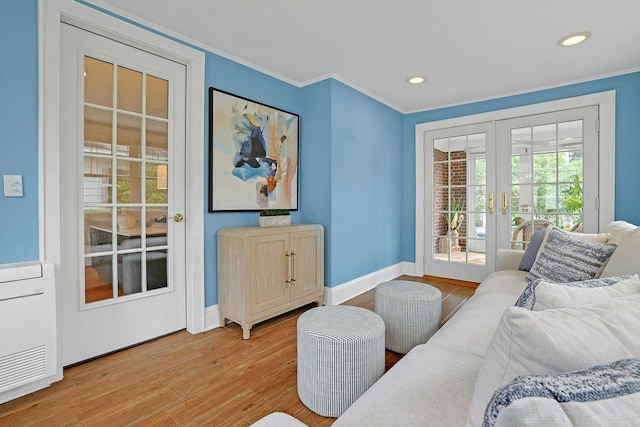 48 Faneuil Pl, New Rochelle, NY 10801 - living room featuring french doors, light wood-style floors, ornamental molding, and recessed lighting