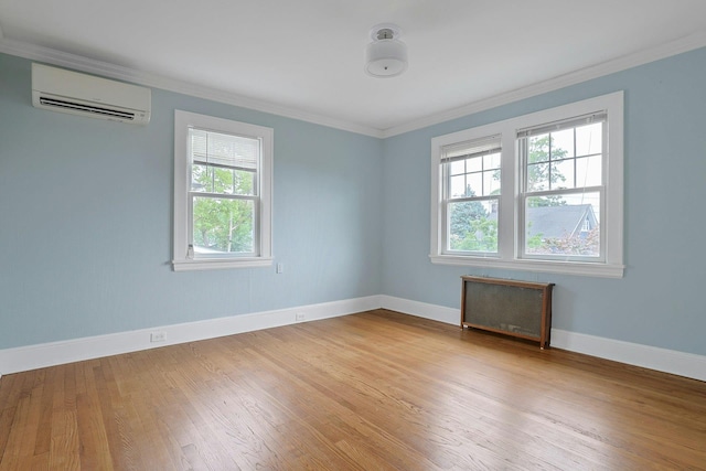 48 Faneuil Pl, New Rochelle, NY 10801 - unfurnished room with a wall unit AC, radiator, crown molding, and light wood finished floors